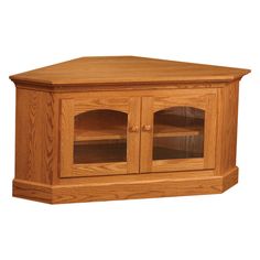 a wooden corner tv stand with glass doors on the front and bottom shelves in oak