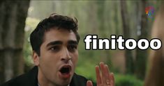 a man making a face with the words'fintoo'in front of him