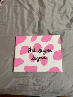 a pink and white sign with the words phi sigma digna on it