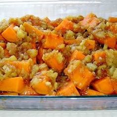 a casserole dish filled with sweet potatoes and stuffing