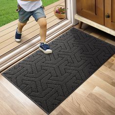 a child is stepping on the door mat