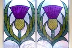 two stained glass windows with flowers on them