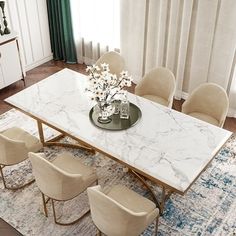 a marble dining table surrounded by beige chairs