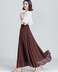 * A long skirt with fixed waist and side zipper. * A-line shape and wide hem, can make you look more taller and slimmer. * Made of pearl chiffon and fully lined. * Can custom make waist size and skirt length. * Material: 100% polyester * Size: True to US size, US 0-US 20 are available, you can let us know your usual size and height in your order. * Shipping: Free shipping Processing time : 5-7 Business days Delivery time : 7-20 Business days Tracking number available If you need rush order or ex Chic A-line Flowy Maxi Dress, Chic Flowy Skirt With Wide Hem, White Maxi Length Lined Skirt, White Lined Maxi Skirt, Flowy Wide Leg White Skirt, White Ruffled Maxi Skirt, Summer Skirt With Lined Wide Hem, Relaxed Wide Hem Maxi Skirt For Summer, Summer Maxi Skirt With Wide Hem