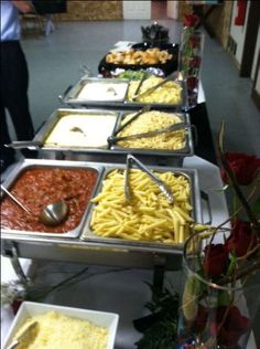 a buffet line with many different types of food