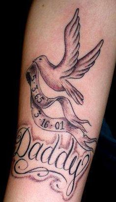 a tattoo with the words daddy and a bird on it