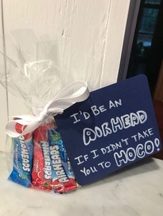 a candy bar wrapped in cellophane and tied to a sign that says i'd be an arrhead if i don't take you to moo