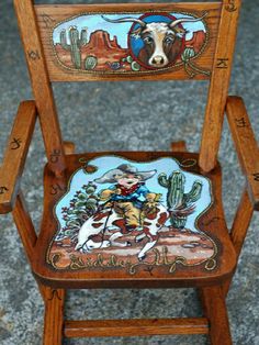 a child's rocking chair with an image of a cowboy on it