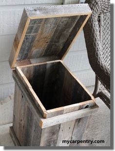 an empty wooden box sitting on top of a chair