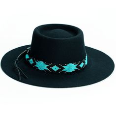 Price includes a Brigitte Sambboho hat & a Saint Barth hatband. Save 10% with this bundle. Select hat size. Hatband is one size fits all. Hatband is removable. The fanciest hat you will ever wear. Sambboho's Brigitte black hat is a dipped crown boater design with a custom trimmed genuine velvet black band. A structured and stiff short-brimmed boater style. Use to make an impression! Dipped crown oval boater hat in Black Trimmed with genuine Velvet Black Band Hat material: 100% soft Brazilian woo Beaded Hats, Billy Jack, Beaded Belts, Leather Quiver, Cowboy Hat Bands, Closet Clothing, Beaded Hat Bands, Native Beading Patterns, Hat Bands