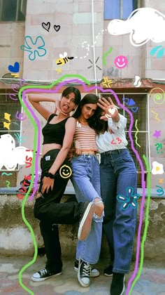 two young women posing for a photo in front of a building with graffiti on it