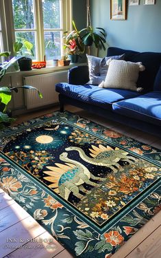 a living room with a blue couch and rug on the floor next to a window