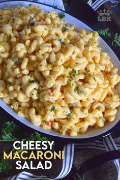 a plate full of macaroni and cheese with parsley