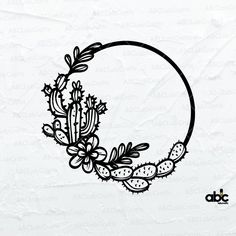 a cactus and succulent wreath with the letter o on it