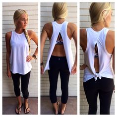 the back of a woman's white tank top and black leggings