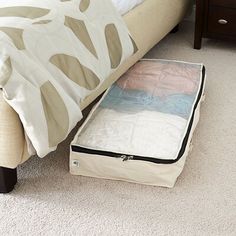 a bed sitting on top of a white carpet covered floor