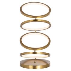 a brass table lamp with three circles on the top and one light in the middle