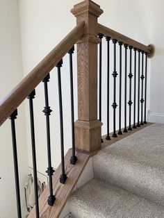 an image of a stair railing in a house or office area with carpeted flooring