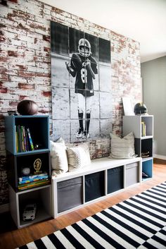 a brick wall with a football player on it and some bookshelves in front of it