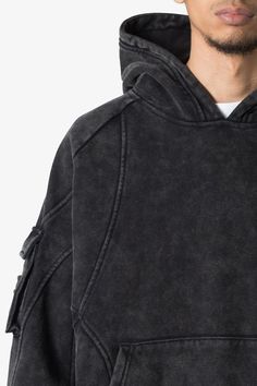 the Cargo Pocket Hoodie features an oversized fit with a dropped shoulder design, front pouch pocket, cargo pockets on the sleeves, ribbing at the wrists and waist, and finished in both an acid washed and brushed fleece fabric. details oversized fit 100% cotton model is 6’1, 140 lbs and wears a size medium Hoodie Design Ideas Inspiration, Oversized Hoodie Men, Hoodie Design Ideas, Clothes Wishlist, Classy Outfits Men, 140 Lbs, Oversize Pullover, Stylish Hoodies, Dye Fabric