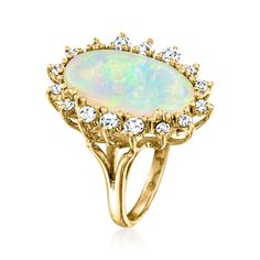 Ross-Simons - C. 1980 Vintage Opal, .75ct t. w. Diamond Ring Oval Cut in 14kt Yellow Gold. Size 5. C. 1980. Swirling with a nearly magical play of color, this sensational Estate collection cocktail ring celebrates the unique beauty of its 18x10mm oval opal cabochon centerpiece. Finely crafted in polished 14kt yellow gold and bordered by .75 ct. t. w. round brilliant-cut diamonds. 7/8" wide. Diamond and opal ring. Exclusive, one-of-a-kind Estate Jewelry. Opal birthstones are the perfect gift for Diamond Ring Oval, Opal And Diamond Ring, Opal Birthstone, Jewelry Opal, Unique Beauty, Ring Oval, Opal Ring, Round Brilliant Cut Diamond, Cocktail Ring