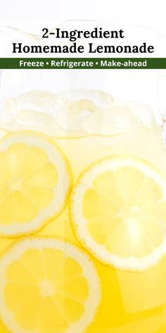 lemonade is served in a pitcher with ice and garnish on the rim