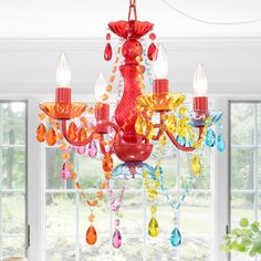 a red chandelier hanging from a ceiling