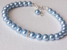 Wedding Light Blue Pearl Silver One Strand Classic Style Dainty Bridal Bracelet. BRACELET is about 7.20 inches (18.3cm) long plus 1 inch extender chain. BRIDAL EARRINGS SECTION: https://www.etsy.com/shop/LanaChayka?ref=seller-platform-mcnav§ion_id=11638940 BRIDAL JEWELRY SETS SECTION: https://www.etsy.com/shop/LanaChayka?ref=seller-platform-mcnav§ion_id=25839214 BRIDAL NECKLACES SECTION: https://www.etsy.com/shop/LanaChayka?ref=seller-platform-mcnav§ion_id=11638944 Elegant and simple, this stunn Pastel Blue Jewelry, Light Blue And Silver Wedding, Blue Pearl Jewelry, Wedding Light Blue, Blue Bridal Jewelry, Light Blue Jewelry, Blue Pearl Bracelet, Light Blue Bracelet, Blue Pearl Necklace