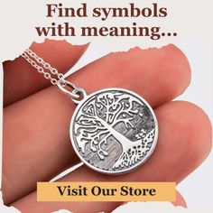 a hand holding a tree of life pendant with the words, find symbols with meaning visit our store