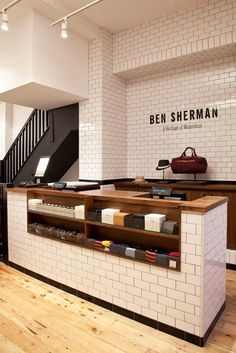 the inside of a store with white brick walls