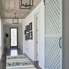 an image of a hallway with white walls and wood flooring on the ceiling is featured in this instagram post