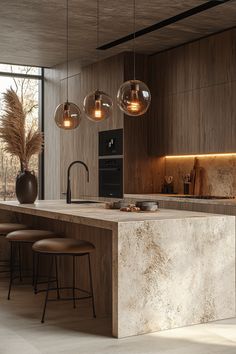 a modern kitchen with marble counter tops and pendant lights hanging from the ceiling over the island