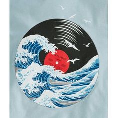 a record with an image of the great wave on it and birds flying over it