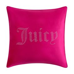 a pink pillow with the word juicy printed in silver on it's front and back