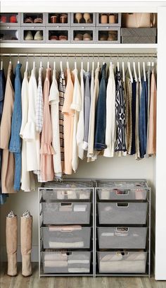 an organized closet with clothes, shoes and booties hanging on the wall next to bins