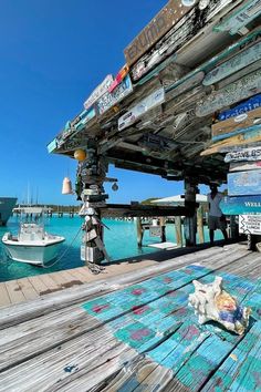 a wooden dock with boats in the water