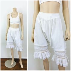 Antique / Vintage Early 1900s Cotton Bloomers - button closures at back waist - lace at leg w/ pin tuck pleat detail - fine white cotton material great vintage condition   appx size - S  26 waist full hip 25.5 length All sales are final / as-is. We do not accept returns. No returns on items that do not fit or color variation. Fitted Cotton Bottoms With Lace Trim, Vintage White Lace Bottoms, White Vintage Lace Bottoms, White Lace Vintage Bottoms, Vintage Style Stretch Bottoms With Lace Trim, Vintage Stretch Bottoms With Lace Trim, Stretch Vintage Bottoms With Lace Trim, Vintage Lace Trim Bottoms For Summer, Vintage Bottoms With Lace Trim For Summer