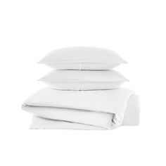 four white pillows stacked on top of each other