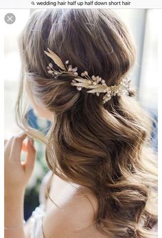 a woman wearing a hair comb with flowers on it