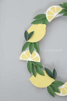 a paper wreath made to look like lemons and leaves