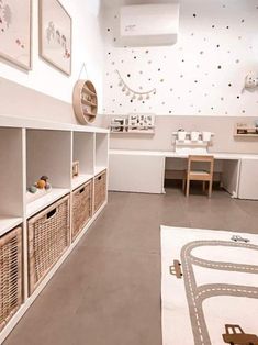 a child's playroom with toy cars and toys on the floor, including bookshelves