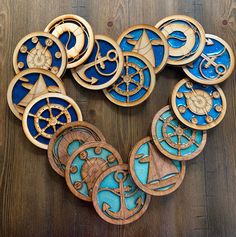 a heart made out of wooden pieces with blue and gold designs