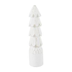 a white ceramic christmas tree on a white background