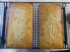 two loafs of banana bread cooling on a wire rack