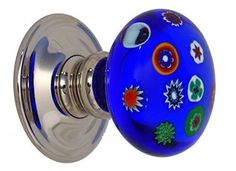 a blue glass door knob with flowers on it