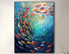 an abstract painting of many colorful fish swimming in the ocean on a blue and white background