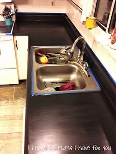 a kitchen with a sink and stove in it