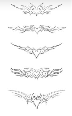 a set of ornate design elements for tattoos or other designs, including wings and hearts