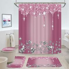 a bathroom with pink shower curtains and rugs