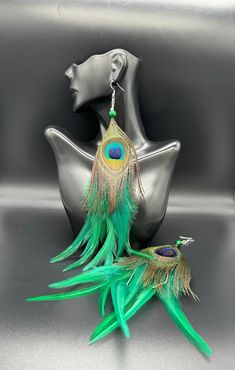 Tribal style green feathers and peacock feather dangle earring . Sold as pair Luxury Peacock Design Earrings For Festivals, Green Feathered Earrings, Luxury Peacock Design Jewelry For Festivals, Festive Dangle Jewelry, Music Festival Accessories, Green Feathers, Parrot Feather, Feather Diy, Peacock Feather Earrings